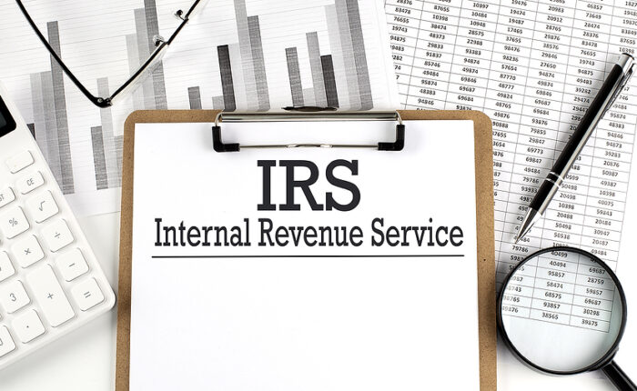 Calibre CPA Group – Paper With IRS - Internal Revenue Service Table on Charts